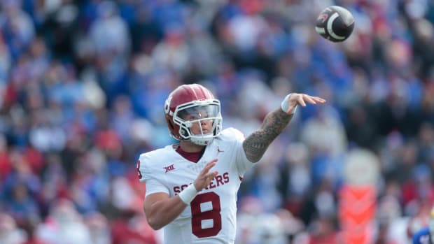Oklahoma redshirt senior quarterback Dillon Gabriel (8) throws a pass in the first quarter of Saturday's game against Kansas inside David Booth Kansas Memorial Stadium.